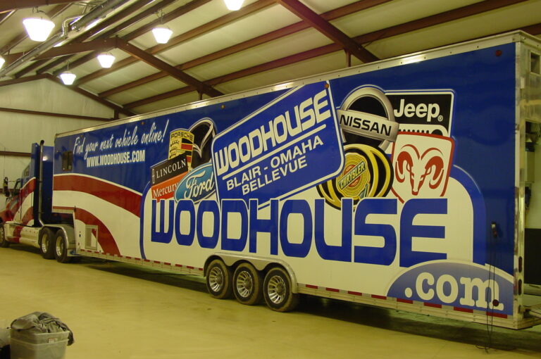Vehicle wrap for Woodhouse Auto wrapped on semi-truck trailer