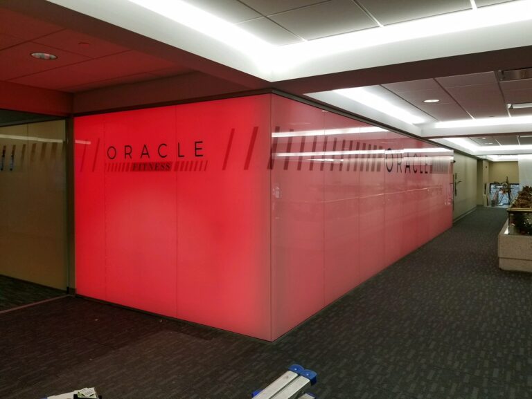 interior red wall display with Oracle Fitness logo and design