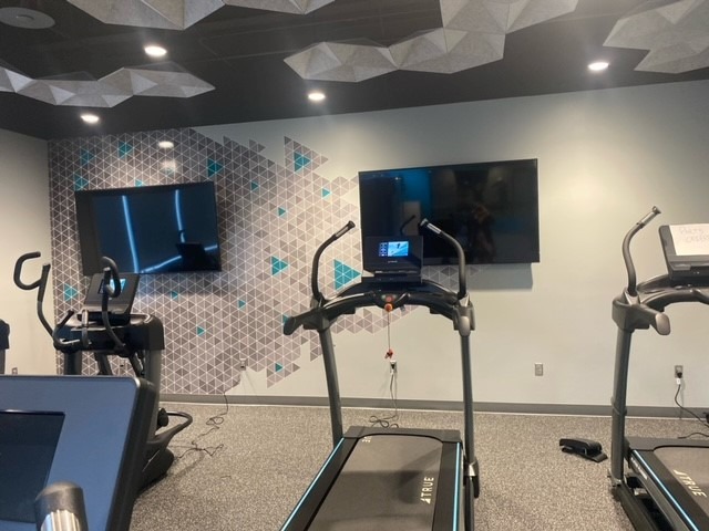 Interior graphics display at small gym with triangle designs