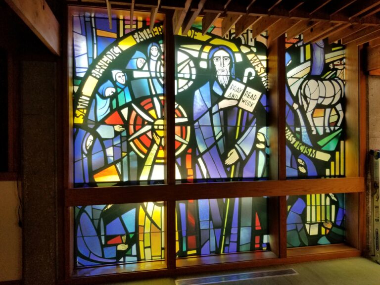 stained glass wall or window in building displaying saint benedict